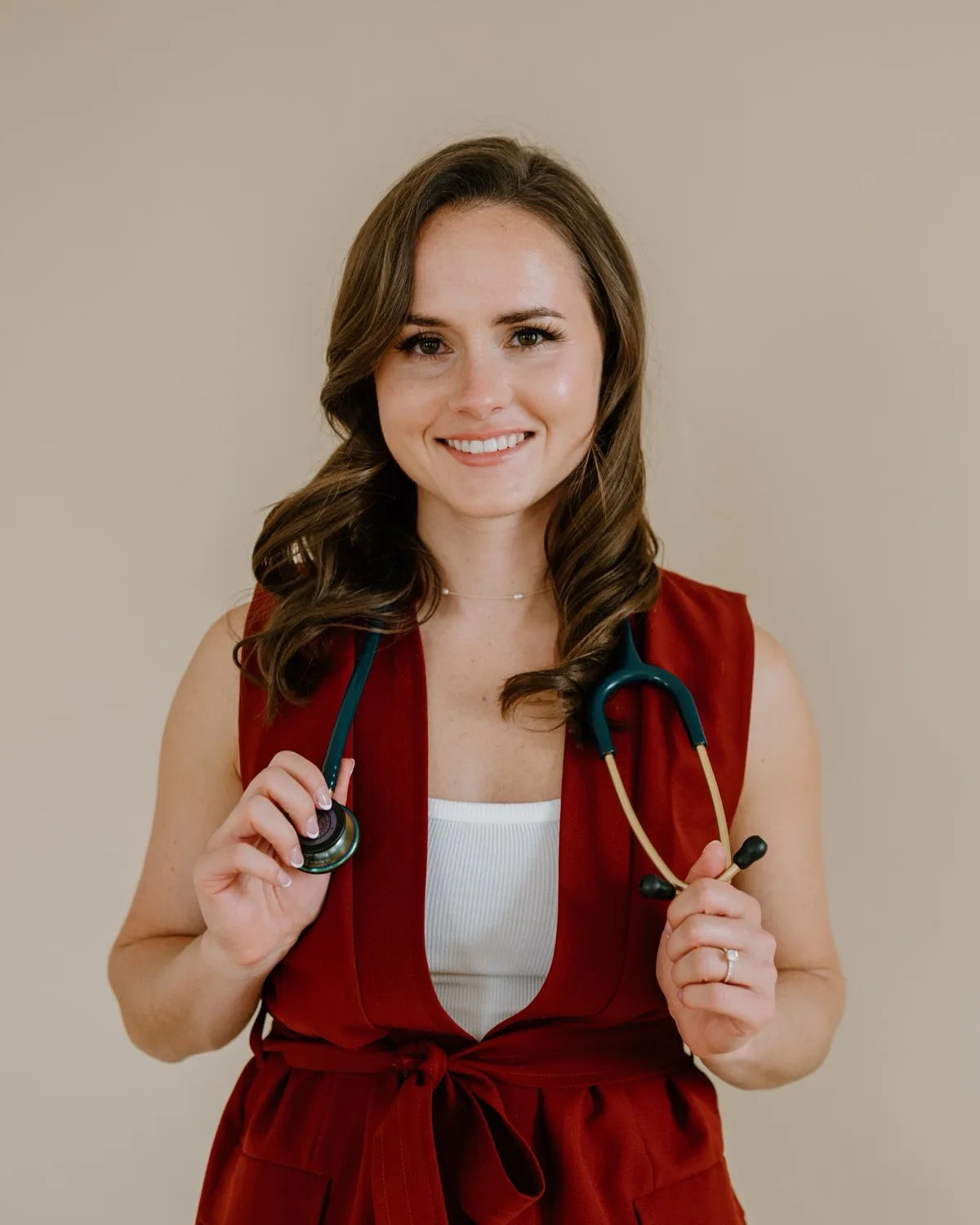 Dr. Mariah smiling in a clinical setting